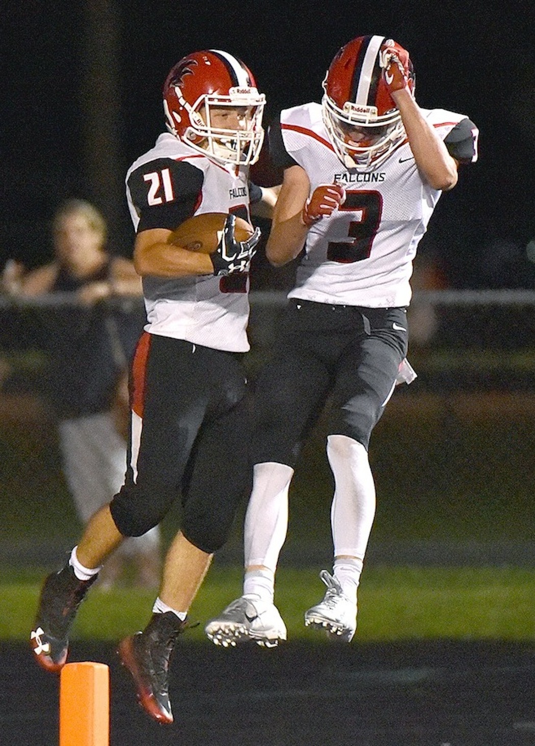 Nick Stott and Tommy Peltier celebrate a touchdown during the Falcons' 35-12 victory over Hamburg last Thursday. (Photo by James Hibbard)